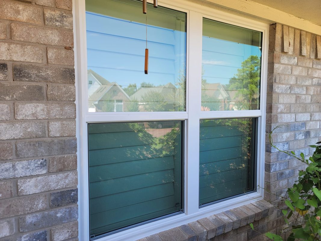 Exterior view of a home with custom plantation shutters in Houston – Enhancing curb appeal, privacy, and energy efficiency.