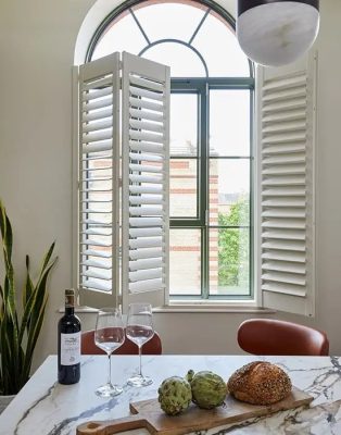 Tier-on-Tier Plantation Shutters in Houston offer the ultimate flexibility with independently operable top and bottom panels.